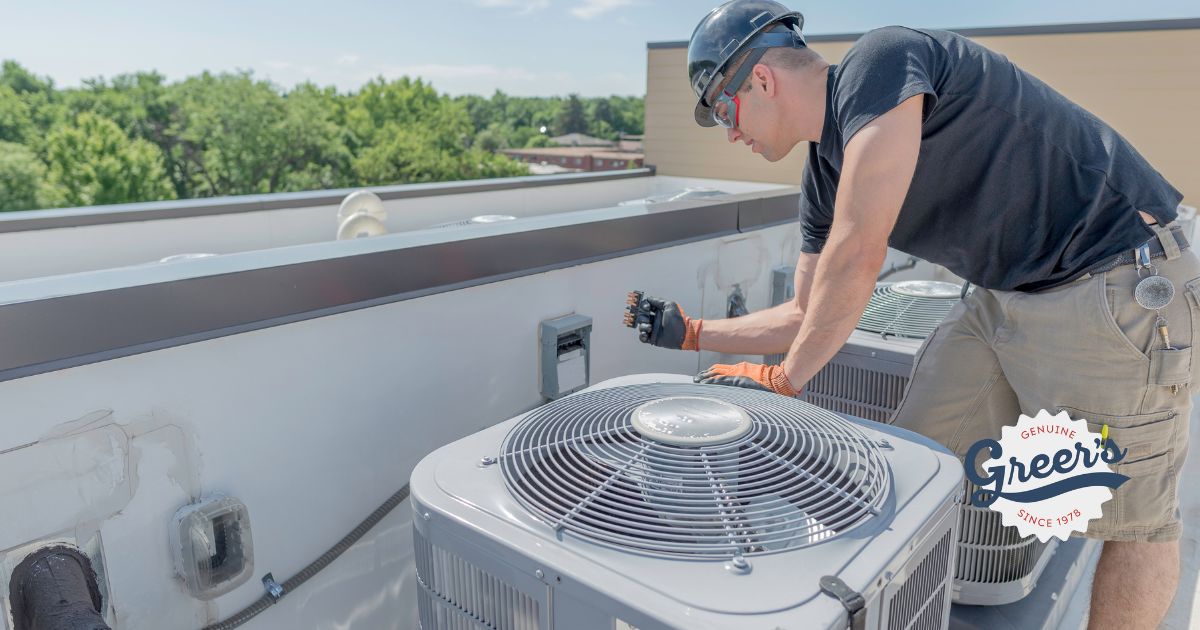 HVAC Sounds - Tech working on HVAC unit - Greer's Heating & Air