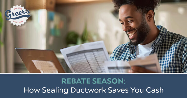 Sealing Ductwork - Man looking at bills smiling - Greer's Heating & Air